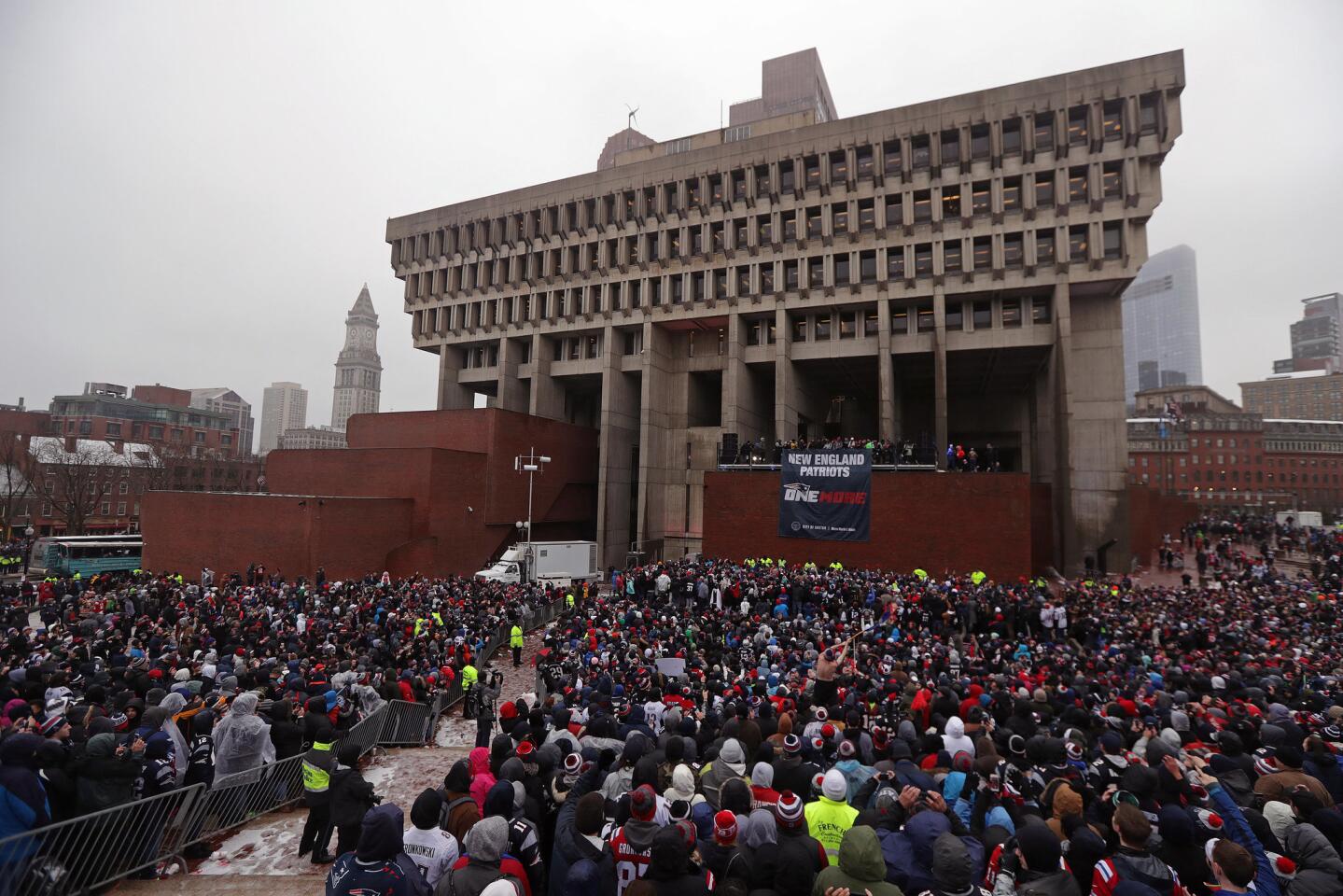 New England Patriots fans gather at city hall plaza for today's rally during Super Bowl LI victory parade in Boston