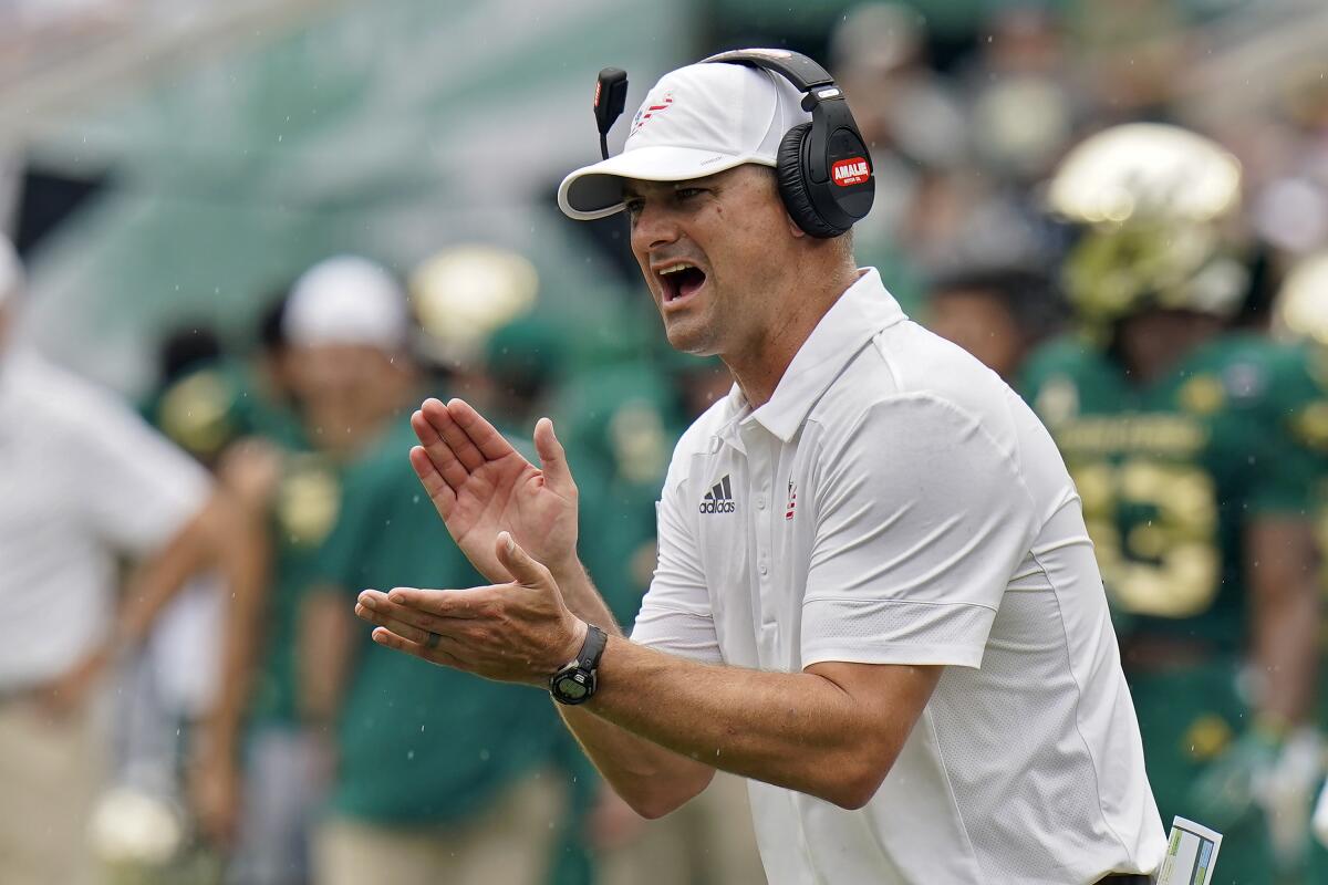 FILE - South Florida head coach Jeff Scott tries to fire up his team during the first half of an NCAA college football game against Florida, Saturday, Sept. 11, 2021, in Tampa, Fla. South Florida plays BYU on Saturday, Sept. 3, 2022. (AP Photo/Chris O'Meara)
