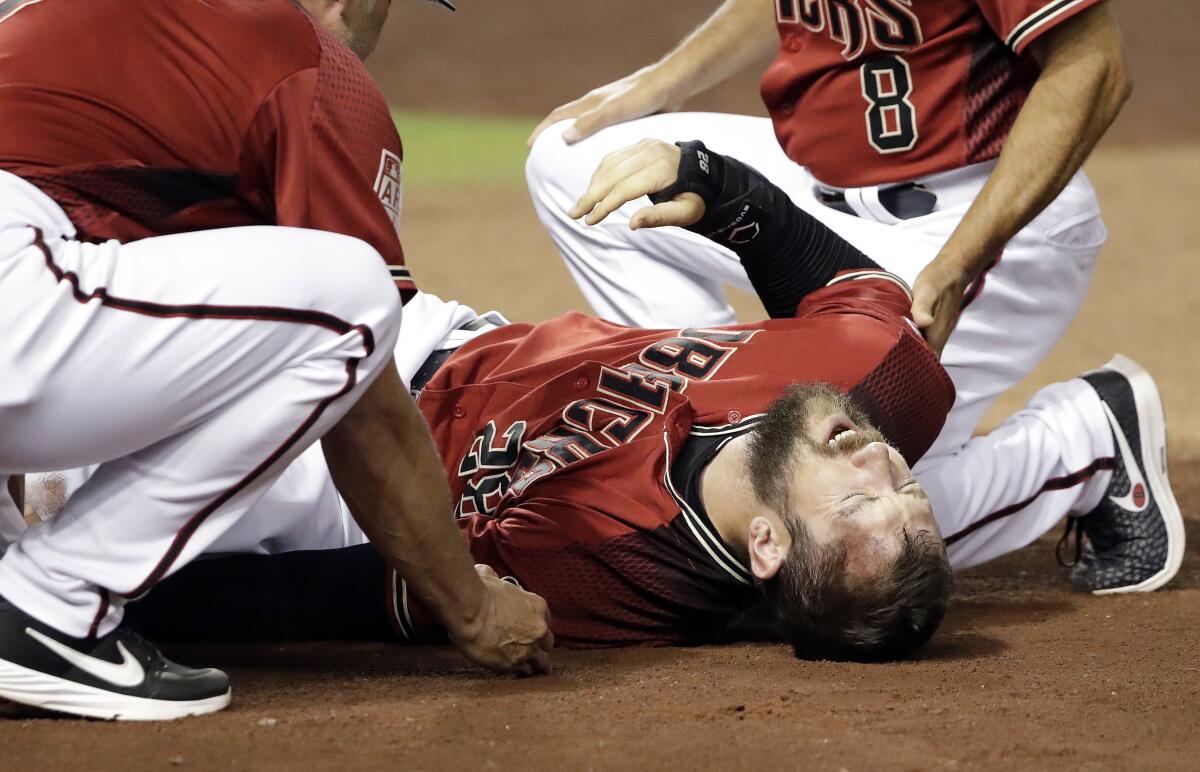 Steven Souza Jr. lies on the field in agony after sustaining a knee injury while with the Arizona Diamondbacks.
