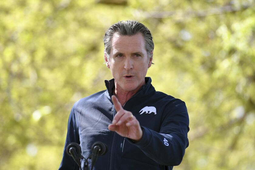 California Gov. Gavin Newsom speaks during a visit by first lady Jill Biden at The Forty Acres, the first headquarters of the United Farm Workers labor union, in Delano, Calif., Wednesday, March 31, 2021. (Mandel Ngan/Pool via AP)