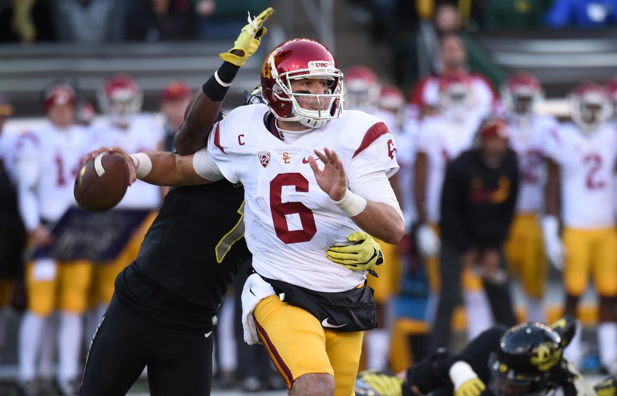 USC quarterback Cody Kessler looks to pass under pressure against Oregon on Nov. 21.