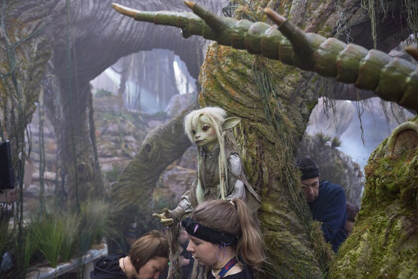It takes multiple people to bring the world of Thra to life. Pictured here, "The Dark Crystal: Age of Resistance" crew members who put the puppet Deet, voiced by Nathalie Emmanuel, in motion.