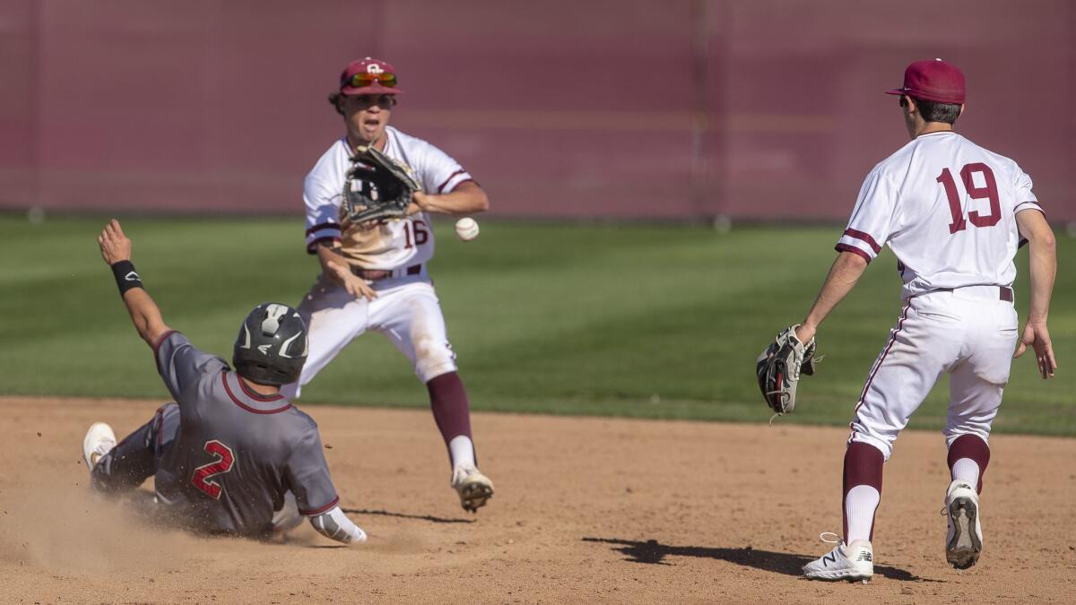 Ocean View High's Matt Starr, shown receiving a throw against Segerstrom on March 15, scored two runs in the Seahawks' game at Camarillo on Saturday.