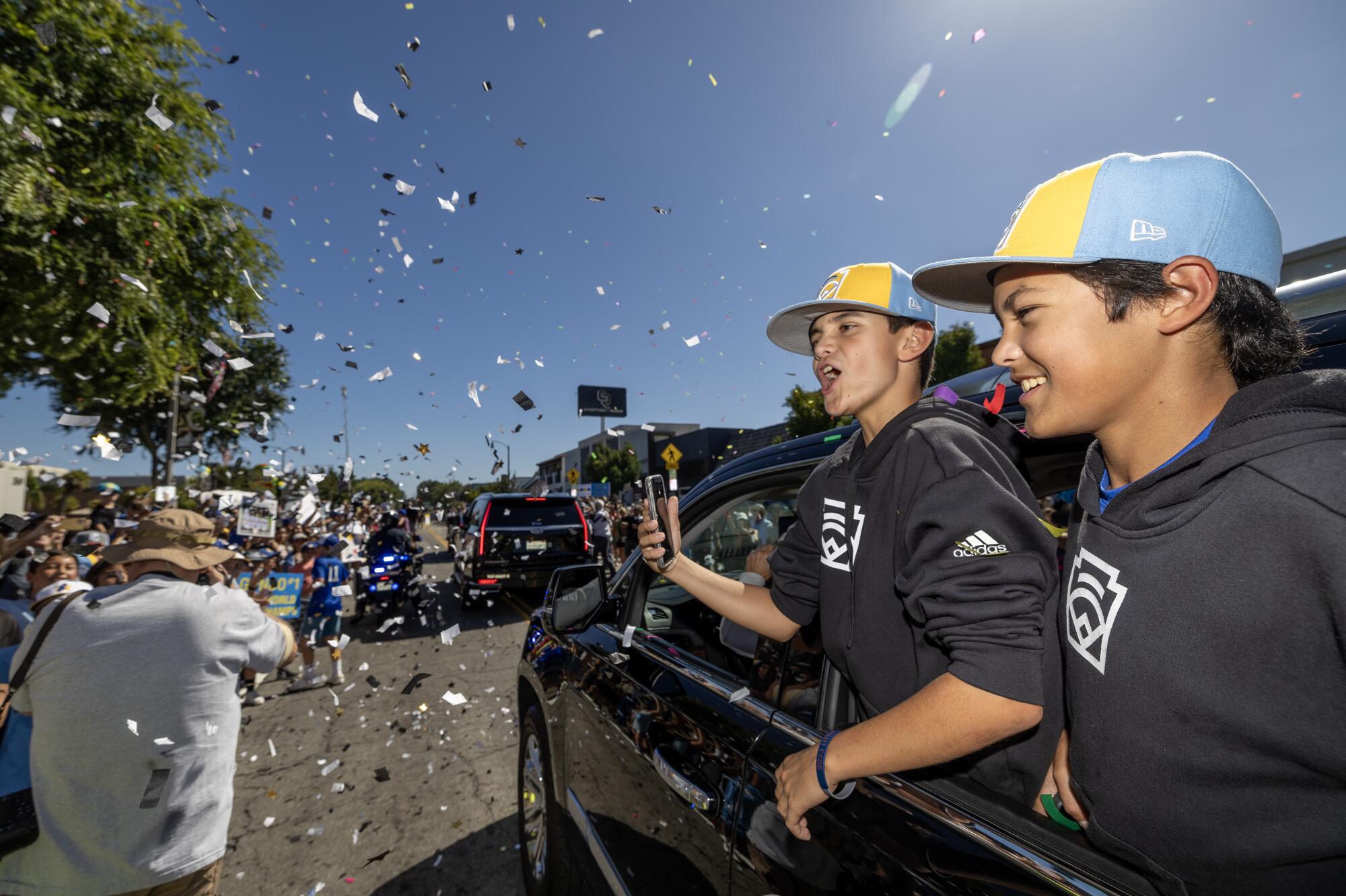 El Segundo Little League All Stars players Quinn Boehle, left, and Lennon Salazar celebrate