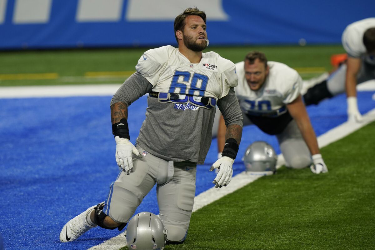 Detroit Lions offensive tackle Taylor Decker (68) finishes stretching before drills at the Lions NFL football practice, Wednesday, Sept. 2, 2020, in Detroit. (AP Photo/Carlos Osorio)