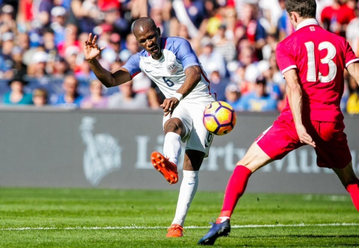 Darlington Nagbe (6) of the United States shoots against Nikola Cirkovic of Serbia in the second half.