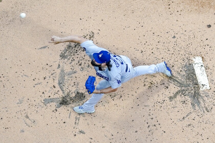 Dodgers starting pitcher Tony Gonsolin throws against the Milwaukee Brewers Aug. 17.