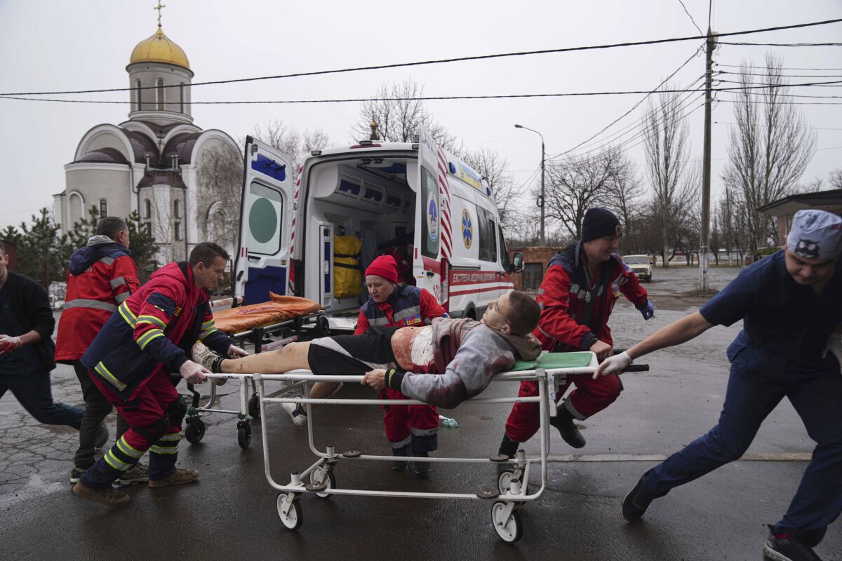 Injured man on a stretcher in Mariupol, Ukraine