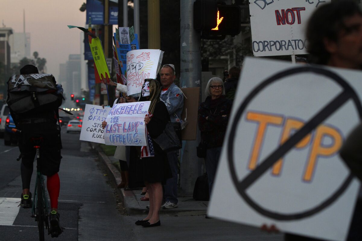 Activists demonstrate against the Trans-Pacific Partnership on Wilshire Boulevard in Los Angeles.