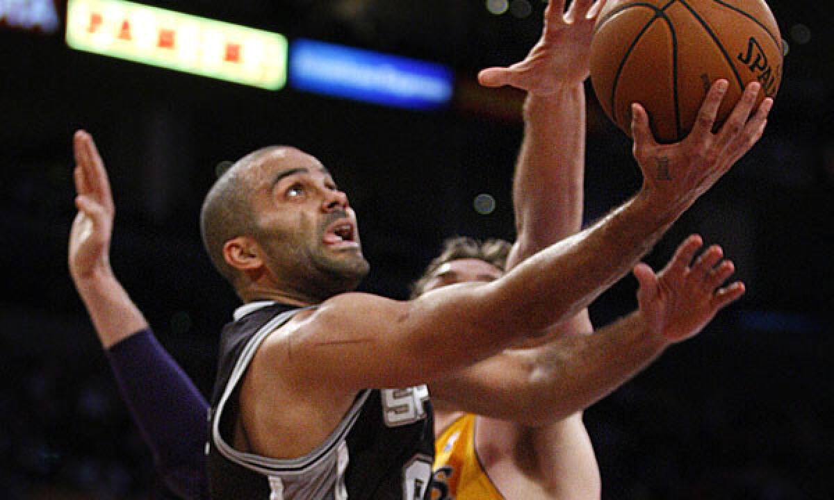 San Antonio Spurs point guard Tony Parker puts up a shot in front of Lakers center Pau Gasol during the Lakers' loss on March 19.