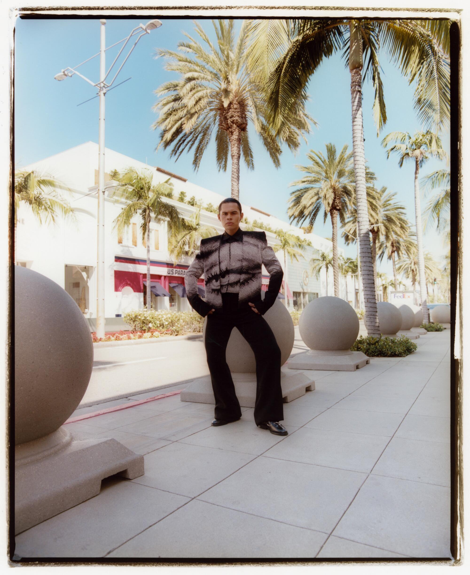 Pablo wears Balmain top, jacket, pants, Jacques Marie Mage sunglasses, Toga shoes.