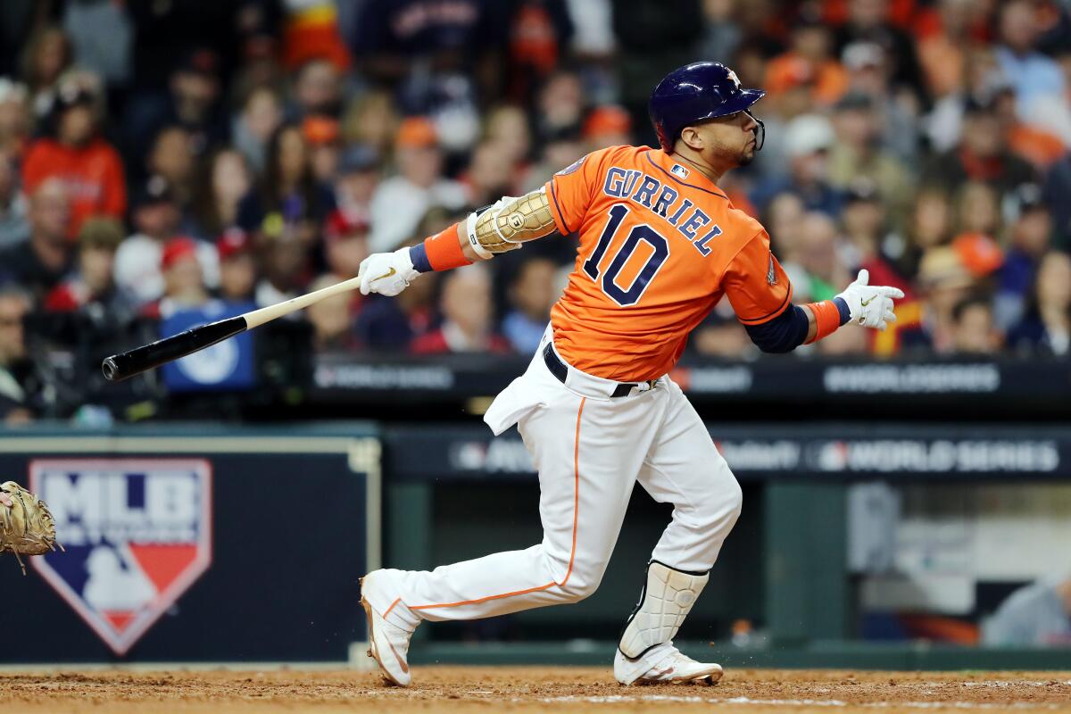 HOUSTON, TEXAS - OCTOBER 30: Yuli Gurriel #10 of the Houston Astros hits a single against the Washington Nationals during the seventh inning in Game Seven of the 2019 World Series at Minute Maid Park on October 30, 2019 in Houston, Texas. (Photo by Elsa/Getty Images) ** OUTS - ELSENT, FPG, CM - OUTS * NM, PH, VA if sourced by CT, LA or MoD **