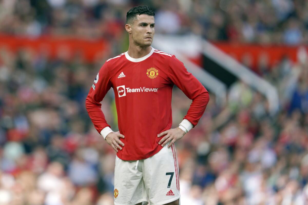 FILE- Manchester United's Cristiano Ronaldo stands on the pitch during the English Premier League soccer match between Manchester United and Norwich City at Old Trafford stadium in Manchester, England, on April 16, 2022. Amid doubts over Ronaldo's future at the club, Manchester United manager Erik ten Hag has said that Cristiano Ronaldo is “not for sale." The team is in Thailand for a preseason tour but the 37-year-old forward didn’t make the trip due to an unspecified family issue. (AP Photo/Jon Super, File)