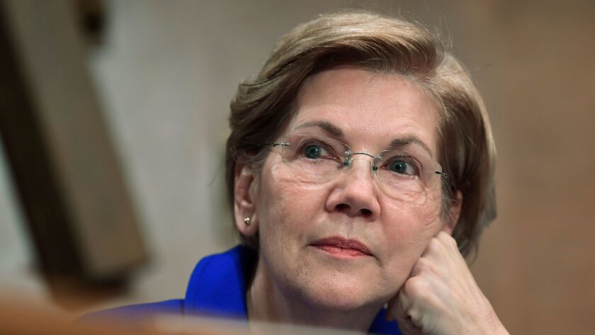 Sen. Elizabeth Warren (D-Mass.) waits to speak during a meeting of the Senate Banking Committee on Dec. 5.