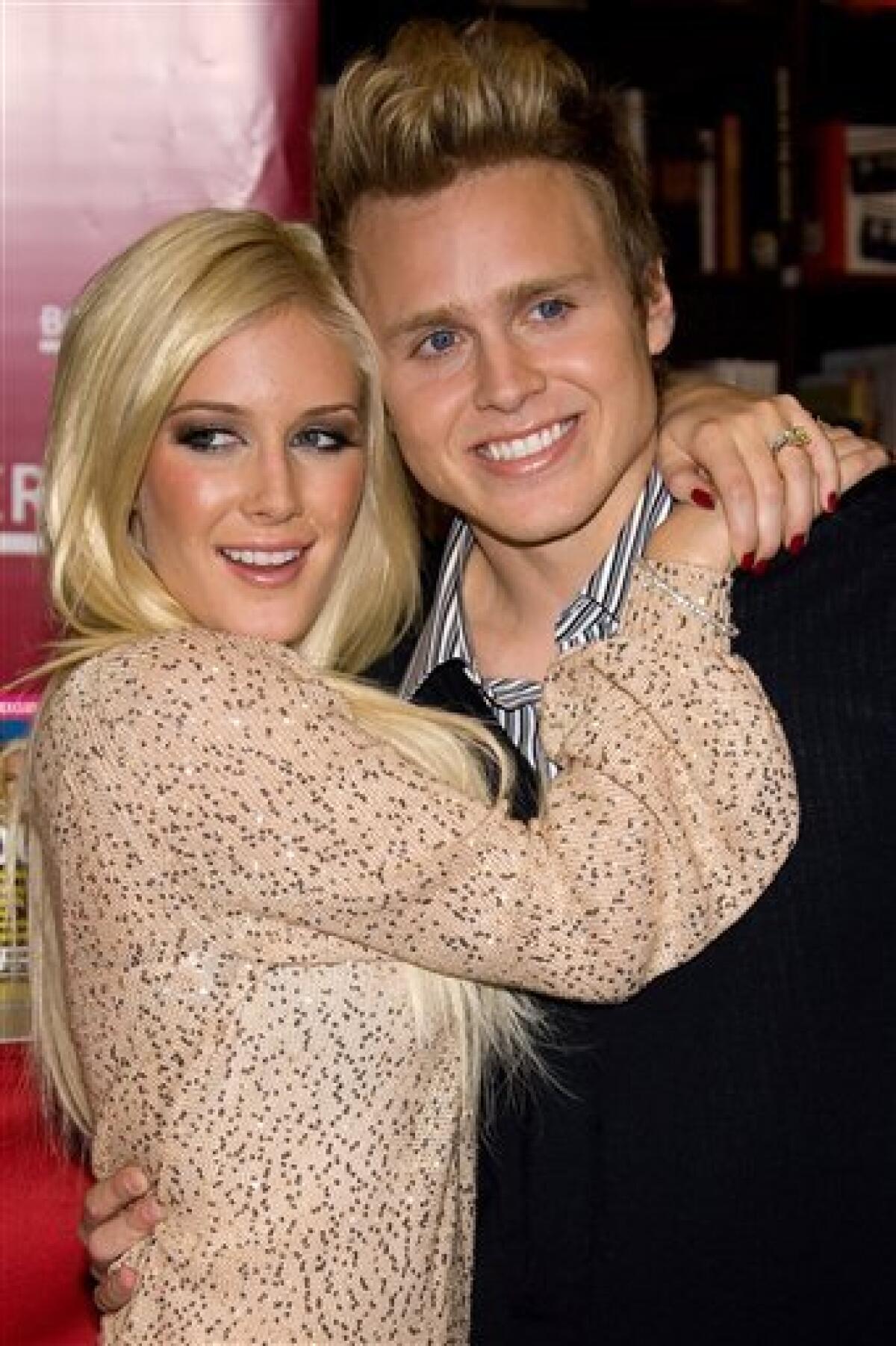 FILE - In this Nov. 16, 2009 file photo, Heidi Montag, left, and Spencer Pratt pose at a book signing event for their book "How To Be Famous" at Borders Books in New York. (AP Photo/Charles Sykes, file)