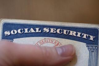 FILE - A Social Security card is displayed on Oct. 12, 2021, in Tigard, Ore. A growing number of older adults are in debt in retirement, according to the 2022 Survey of Consumer Finances from the Federal Reserve. Supplementing retirement savings and Social Security benefits with part-time earnings can make your money go further and help you pay off remaining debt. (AP Photo/Jenny Kane, File)