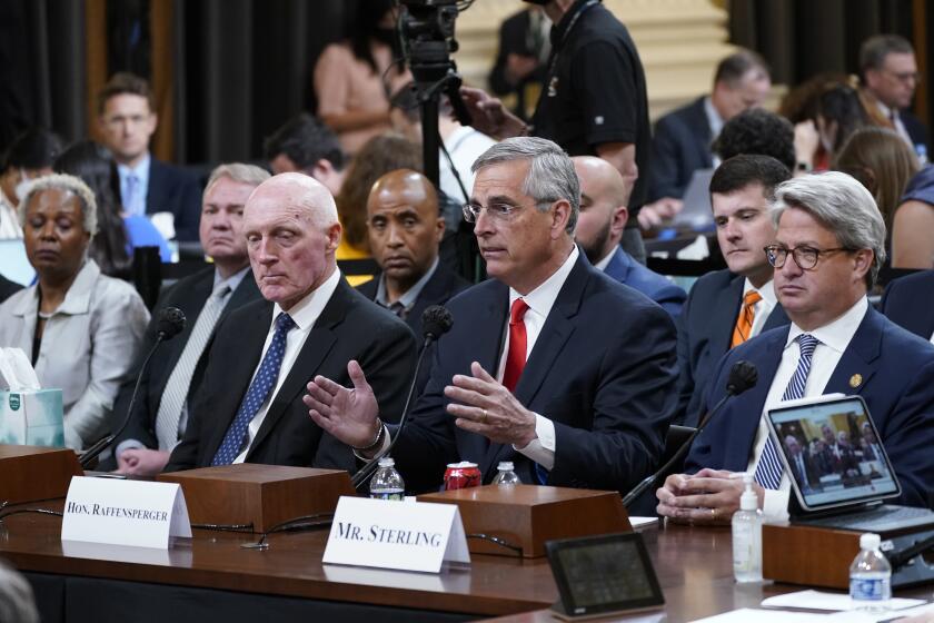 Georgia Secretary of State Brad Raffensperger, center, testifies as the House select committee investigating the Jan. 6 attack on the U.S. Capitol continues, at the Capitol in Washington, Tuesday, June 21, 2022, as Arizona House Speaker Rusty Bowers, left, and Georgia Deputy Secretary of State Gabriel Sterling, right, look on. (AP Photo/J. Scott Applewhite)