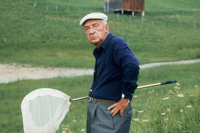 Vladimir Nabokov hunting for butterflies in Switzerland in 1975. The author was famously friends with critic Edmund Wilson -- until he wasn't.