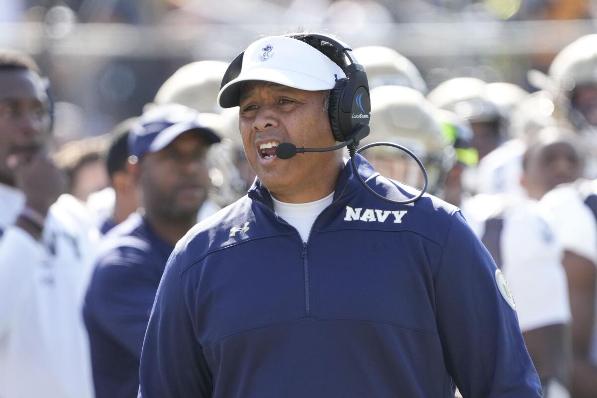 Ken Niumatalolo yells from the sideline during a Navy game against Central Florida.
