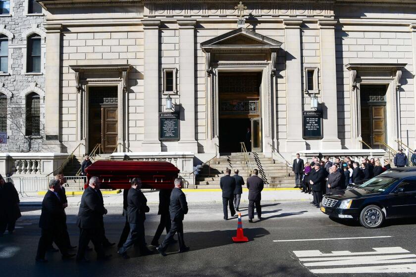 The casket carrying late actor Philip Seymour Hoffman arrives at St. Ignatius of Loyola Church.