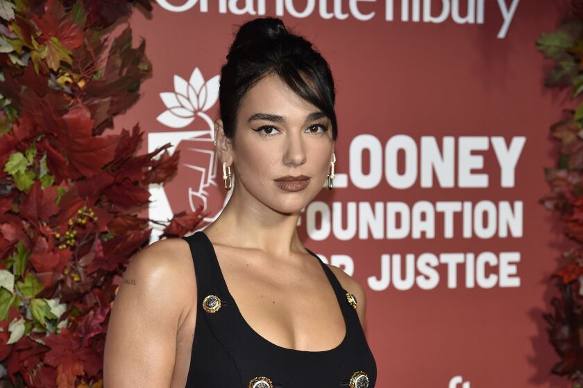 FILE - Dua Lipa attends the Clooney Foundation for Justice Albie Awards at The New York Public Library on Thursday, Sept. 29, 2022, in New York. Albania's president has granted citizenship to British pop star of Albanian origin Dua Lipa. President Bajram Begaj on Sunday, Nov, 27 said Lipa received citizenship ahead of Albania’s 110th anniversary of independence from the Ottoman Empire. (Photo by Evan Agostini/Invision/AP, file)