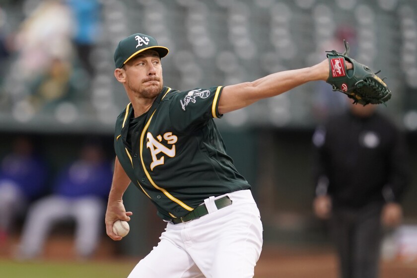 Oakland Athletics' Chris Bassitt pitches against the Texas Rangers during the first inning of a baseball game in Oakland, Calif., Wednesday, June 30, 2021. (AP Photo/Jeff Chiu)