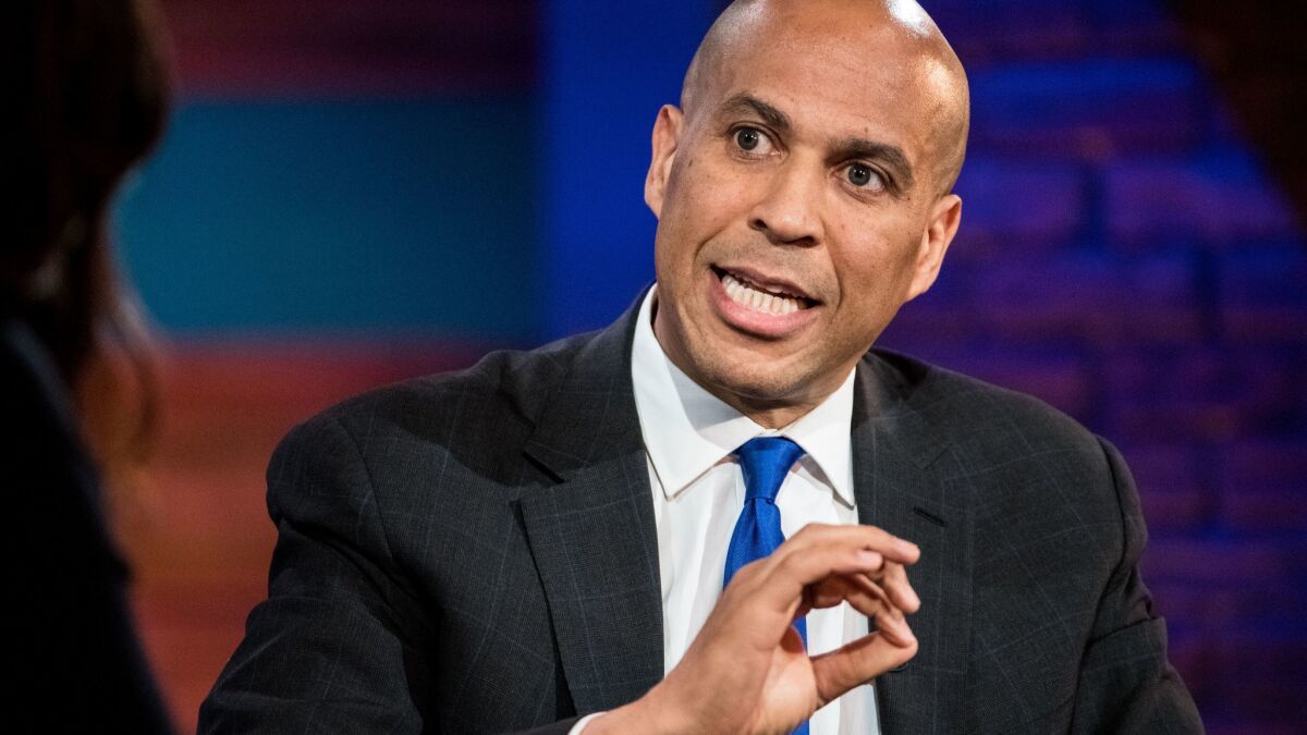 Sen. Cory Booker of New Jersey says he would launch clemency reviews on his first day in the White House.