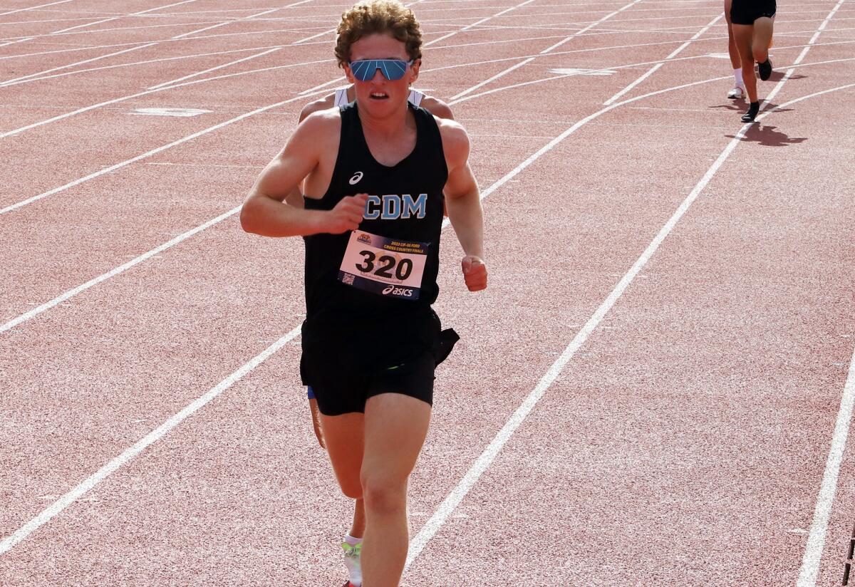 Corona del Mar's Max Douglass (320) competes in the Division 3 boys' race of the CIF finals at Mt. SAC on Saturday.