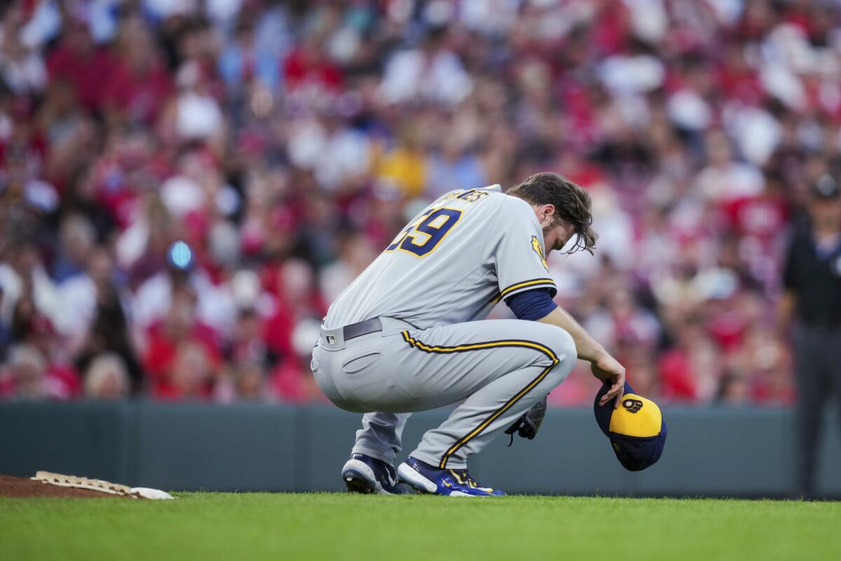 Corbin Burnes recovers from heat scare and strikes out 13 as Brewers edge  Reds 1-0 - The San Diego Union-Tribune