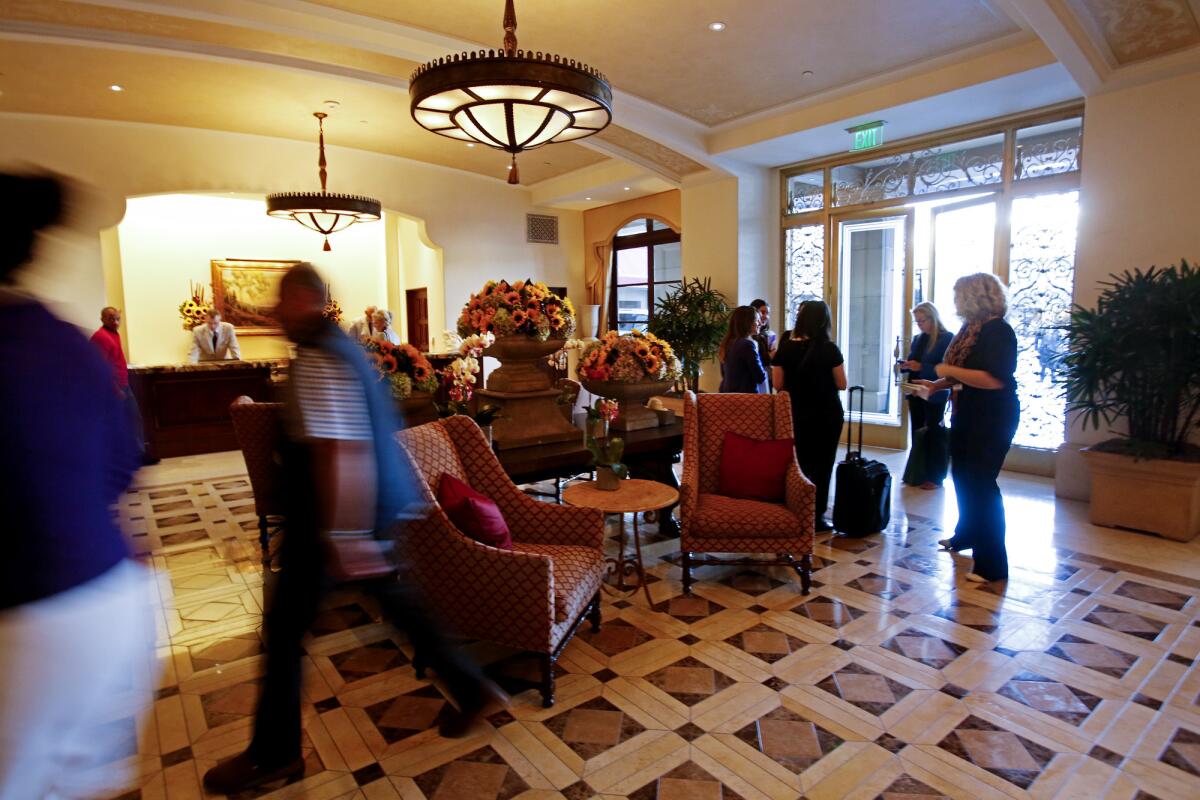 Hotel rates and guest fees are on the rise. A hotel expert says more hotels are charging a fee to check in early. Above, the lobby of the Montage Beverly Hills in shown in 2013.