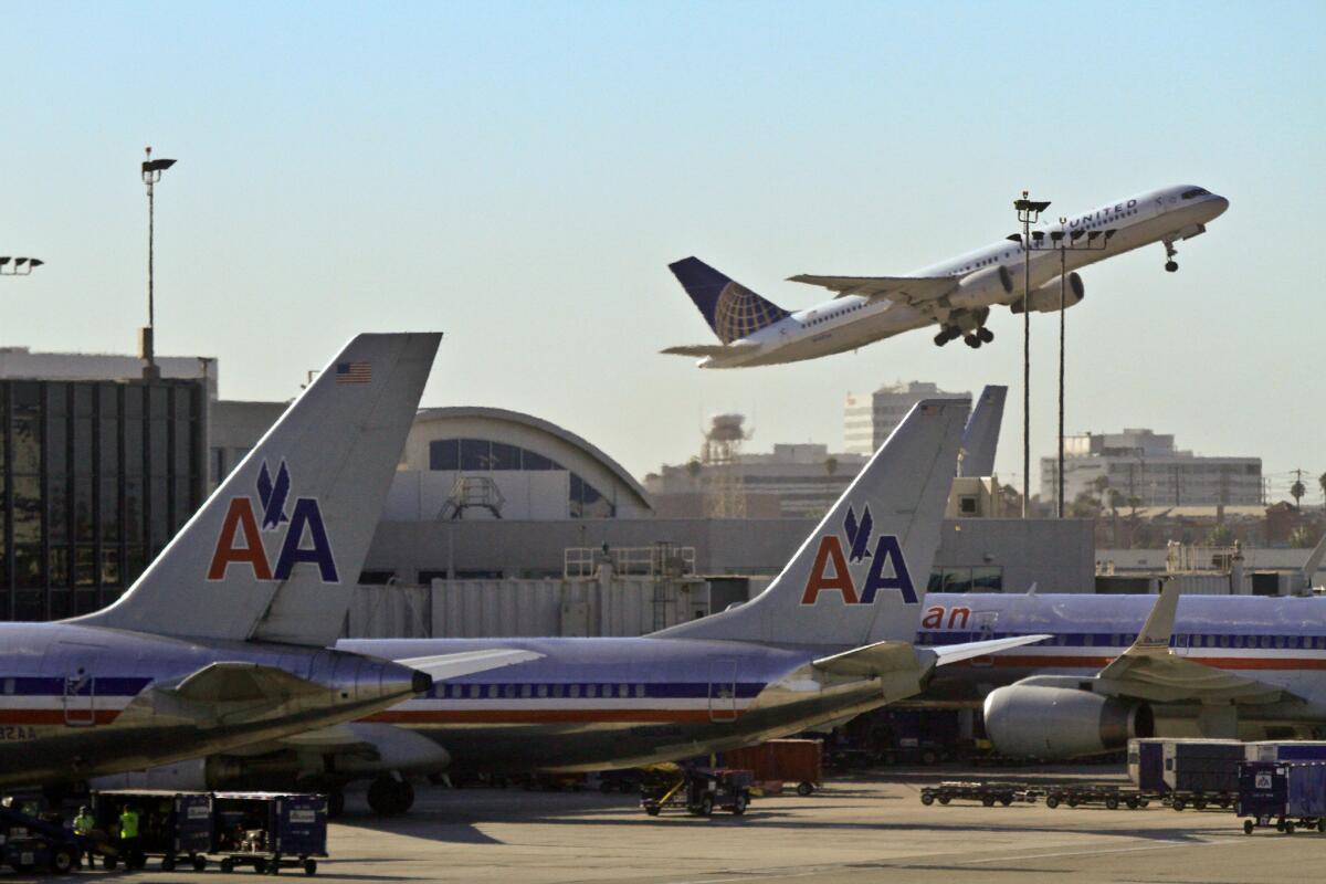 An American Airlines flight en route to Boston turned back and landed at LAX due to a cockpit issue. American Airlines planes are shown at LAX in this 2011 photo.