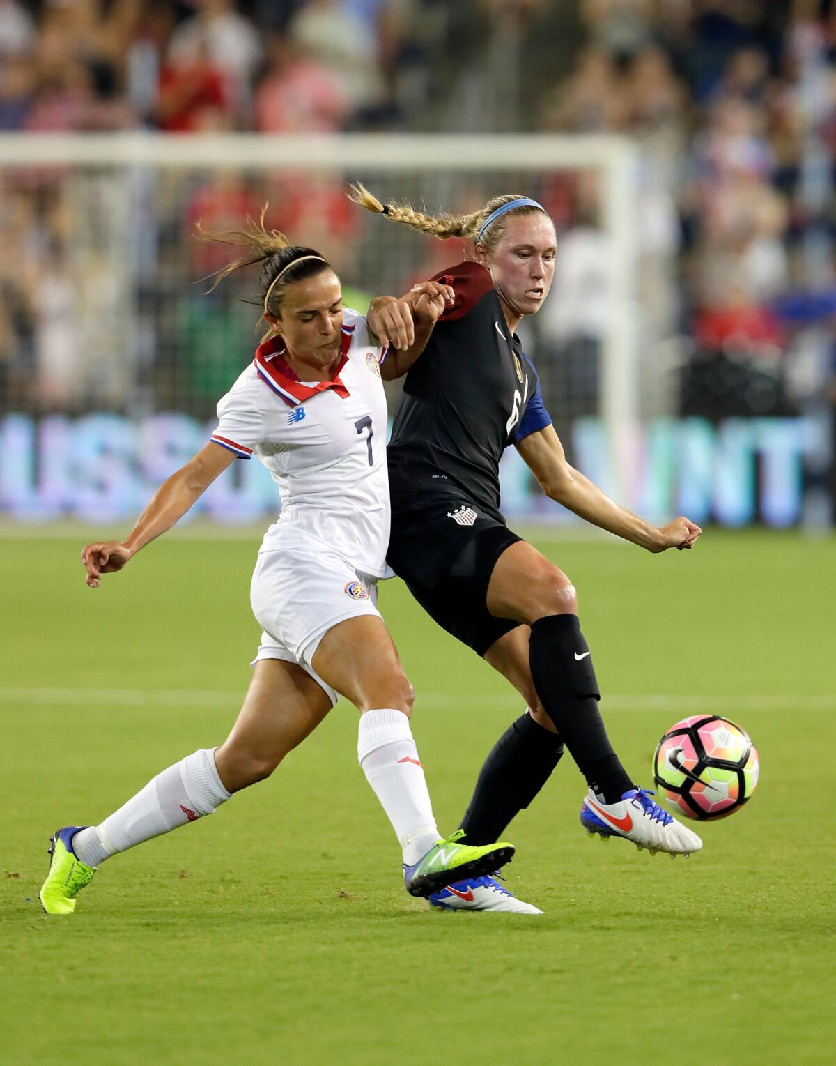 American Whitney Engen (6) vies for the ball against Costa Rica's Melissa Herrera during a game on July 22.