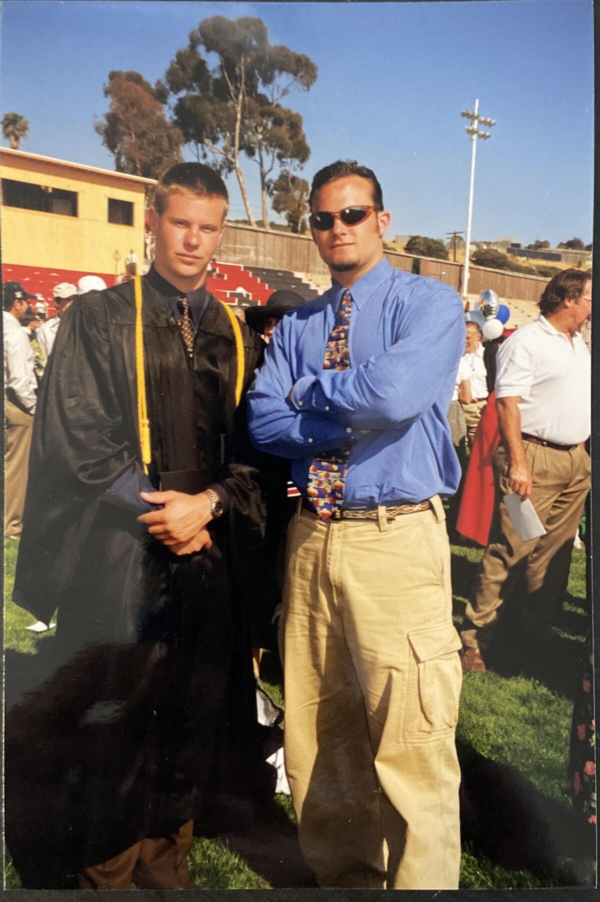 Brothers Griffin and Lucas Marquardt attend Griffin's 1999 graduation from La Jolla High School.