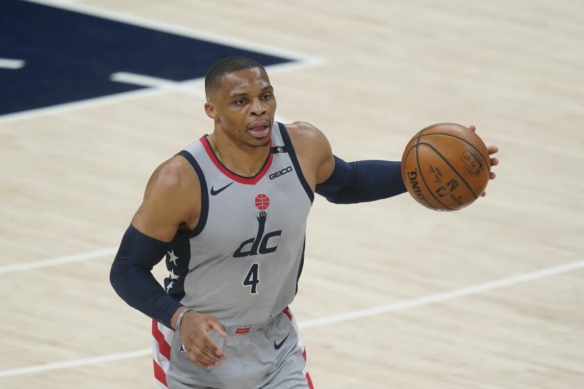 Washington Wizards' Russell Westbrook dribbles during the first half of an NBA basketball game against the Indiana Pacers, Saturday, May 8, 2021, in Indianapolis. (AP Photo/Darron Cummings)