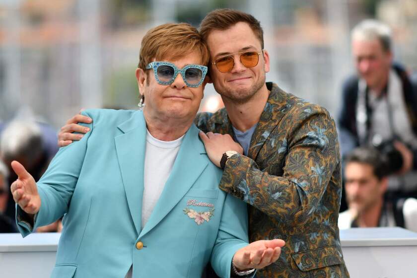 TOPSHOT - British singer-songwriter Elton John (L) and British actor Taron Egerton pose during a photocall for the film "Rocketman" at the 72nd edition of the Cannes Film Festival in Cannes, southern France, on May 16, 2019. (Photo by Alberto PIZZOLI / AFP)ALBERTO PIZZOLI/AFP/Getty Images ** OUTS - ELSENT, FPG, CM - OUTS * NM, PH, VA if sourced by CT, LA or MoD **