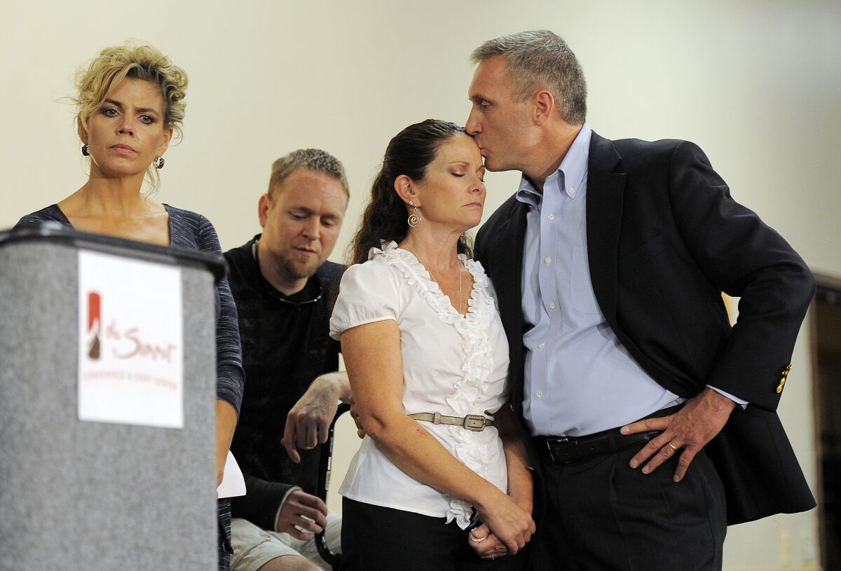 Caren and Tom Teves, right, lost their son Alex in the 2012 movie theater shooting in Aurora, Colo.