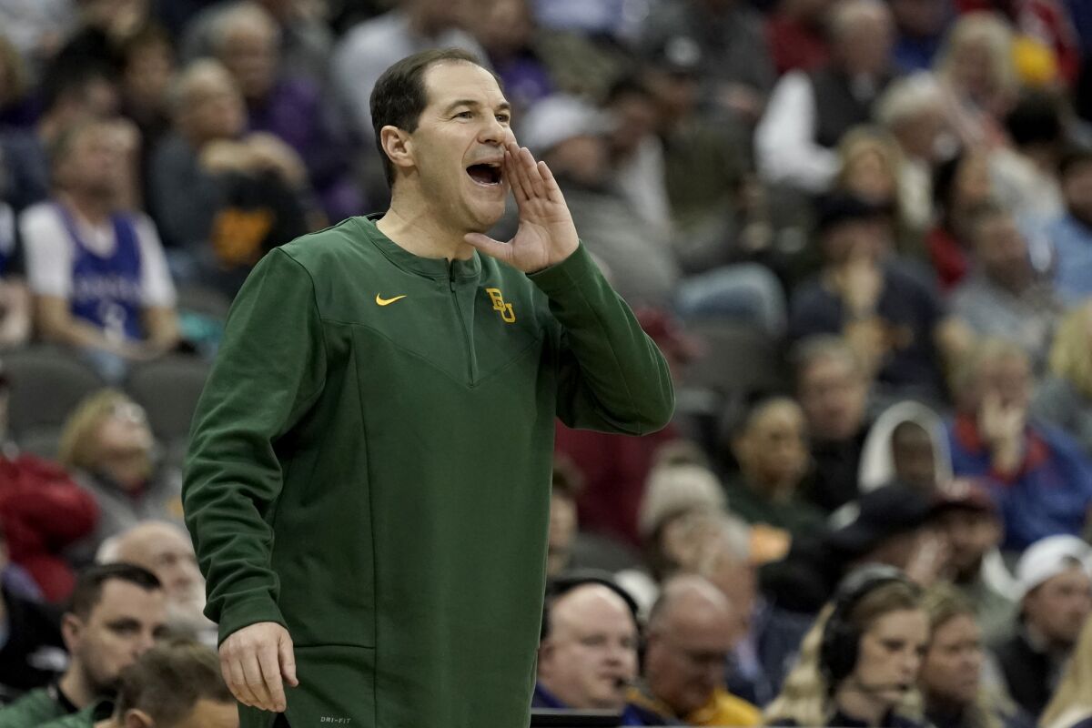 Baylor head coach Scott Drew yells to his players during the second half of an NCAA college basketball game against Oklahoma in the quarterfinal round of the Big 12 Conference tournament in Kansas City, Mo., Thursday, March 10, 2022. (AP Photo/Charlie Riedel)