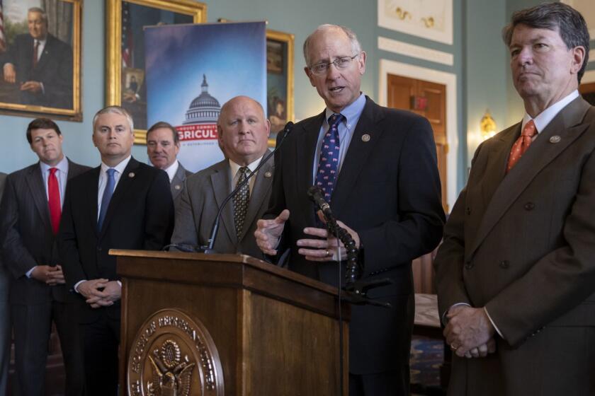 House Agriculture Committee Chairman Mike Conaway, R-Texas, and other Republican members of the panel announces the new farm bill, officially known as the 2018 Agriculture and Nutrition Act, at a news conference on Capitol Hill in Washington, Thursday, April 12, 2018. The bulk of the bill's spending goes toward funding SNAP, the Supplemental Nutrition Assistance Program. From left are Rep. David Rouzer R-N.C., Rep. Jodey Arrington, R-Texas, Rep. James Comer, R-Ky., Rep. Scott DesJarlais, R-Tenn., Vice Chairman Glenn Thompson, R-Pa., Chairman Mike Conaway, R-Texas, and Rep. John Faso, R-N.Y. (AP Photo/J. Scott Applewhite)
