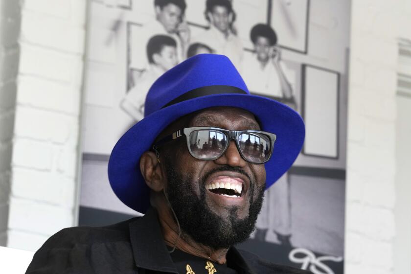 Otis Williams, a vocalist with The Temptations, talks with Motown Museum's Hitsville NEXT programming participants in Detroit, Wednesday, Oct. 4, 2023. (AP Photo/Paul Sancya)