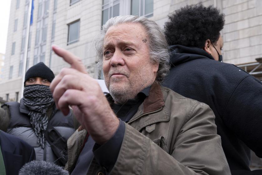 Former White House strategist Steve Bannon arrives at the FBI Washington Field Office, Monday, Nov., 15, 2021, in Washington. Bannon has surrendered to federal authorities to face contempt charges after defying a subpoena from a House committee investigating January 6™s insurrection at the U.S. Capitol. Bannon was taken into custody Monday morning. (AP Photo/Jose Luis Magana)