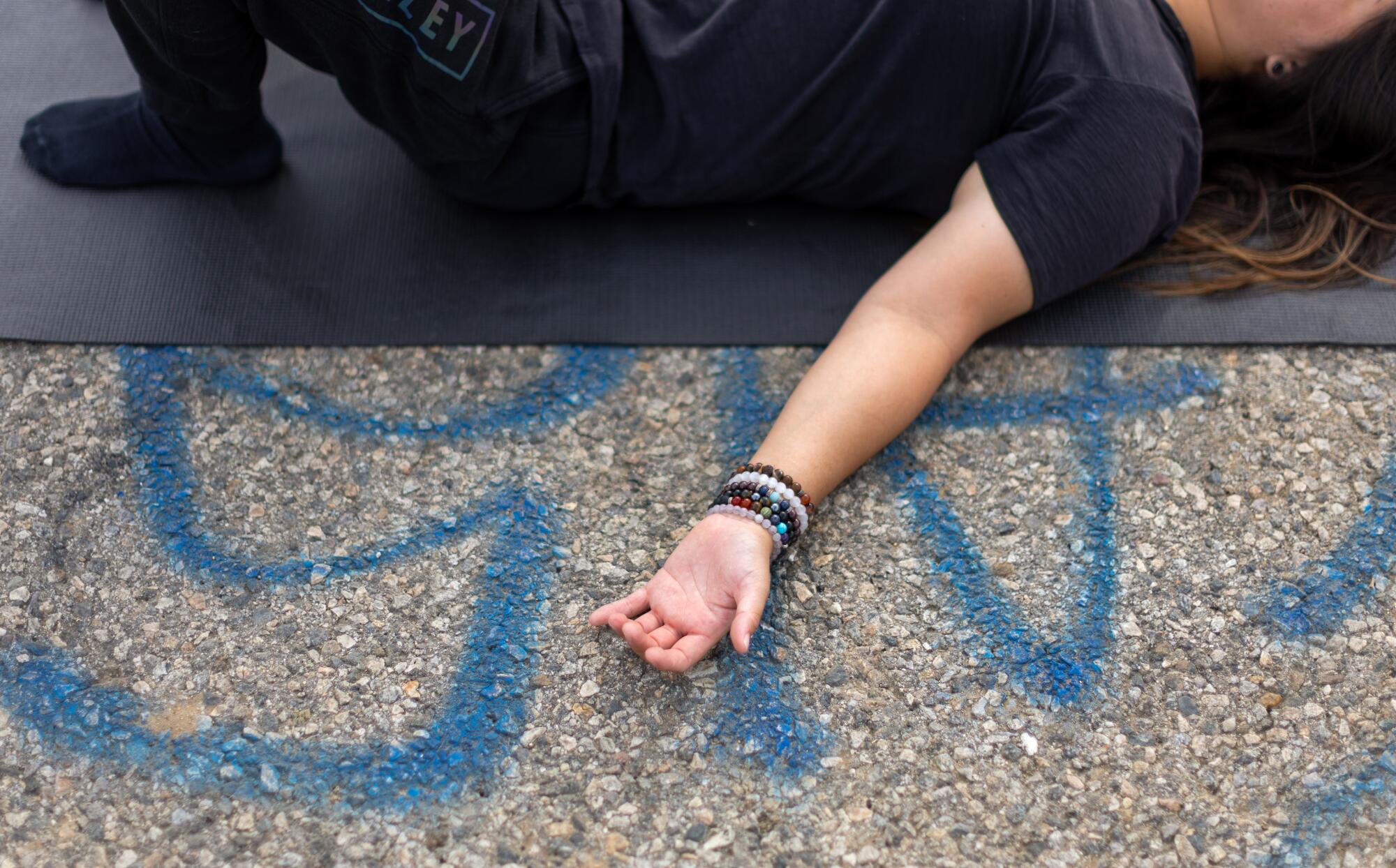 A participant performs breathing exercises during the Natural High alcohol-free party at Elysian Park.