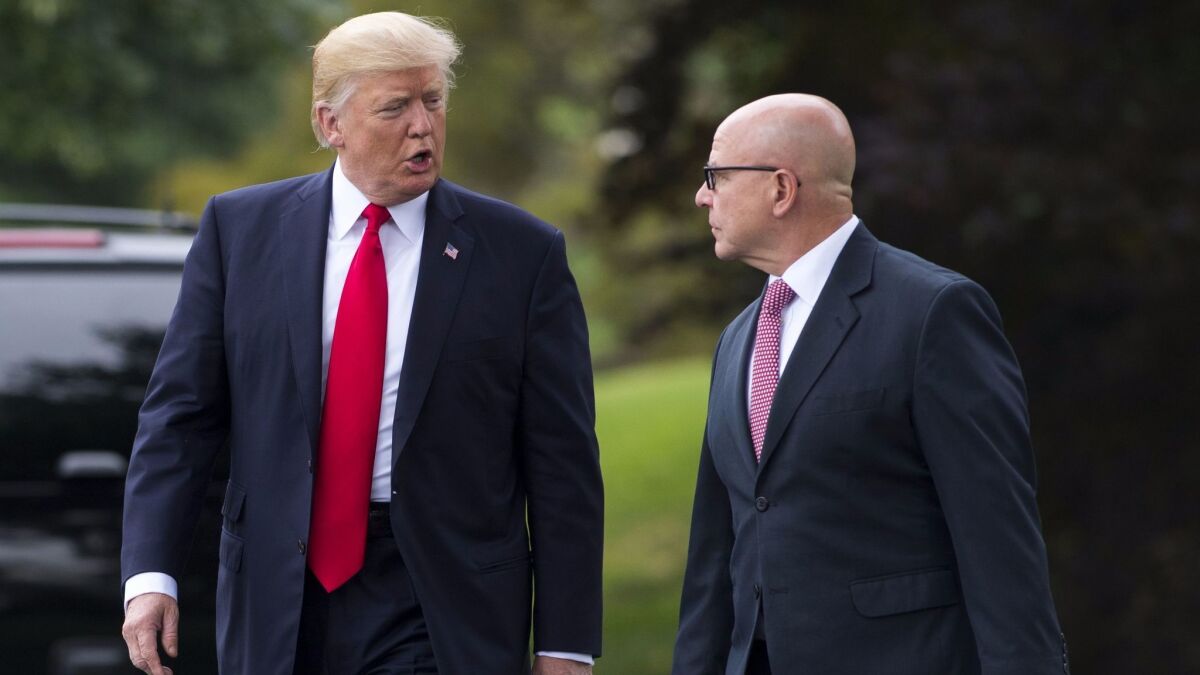 President Trump, left, speaks to national security advisor H.R. McMaster as they walk to Marine One before departing Friday from the South Lawn of the White House in Washington.