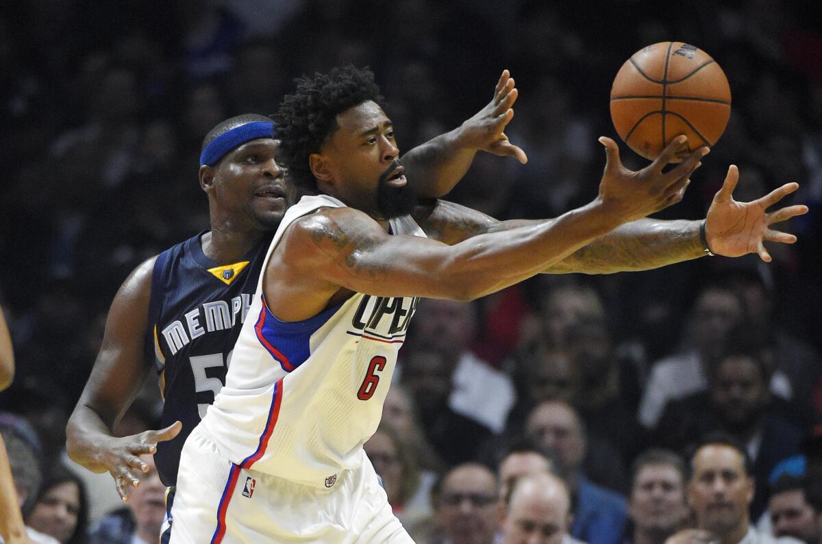 Grizzlies forward Zach Randolph tries to knock the ball free from Clippers center DeAndre Jordan during the first half on Monday.