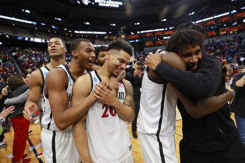 San Diego State's Jaedon LeDee, Micah Parrish, Matt Bradley and Nathan Mensah celebrate after a 57-56 victory over Creighton in an Elite 8 game in the NCAA Tournament on Sunday, March 26, 2023 in Louisville, KY.