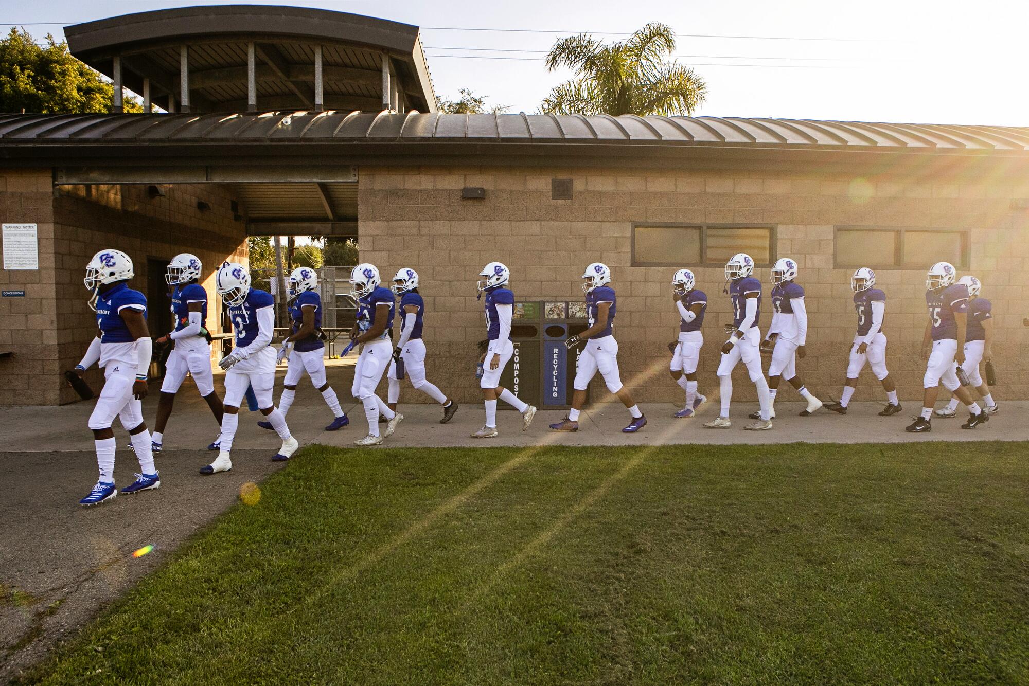 The Centaurs walk in formation towards the field for their Friday night home-opener.