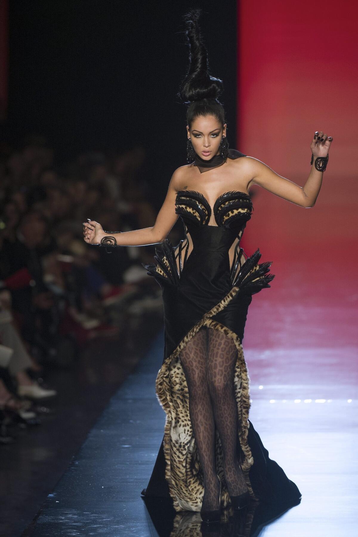 Television personality Nabilla Benattia presents a creation from the Haute Couture Fall-Winter 2013/14 Collection by French designer Jean Paul Gaultier during Paris Fashion Week on Wednesday.