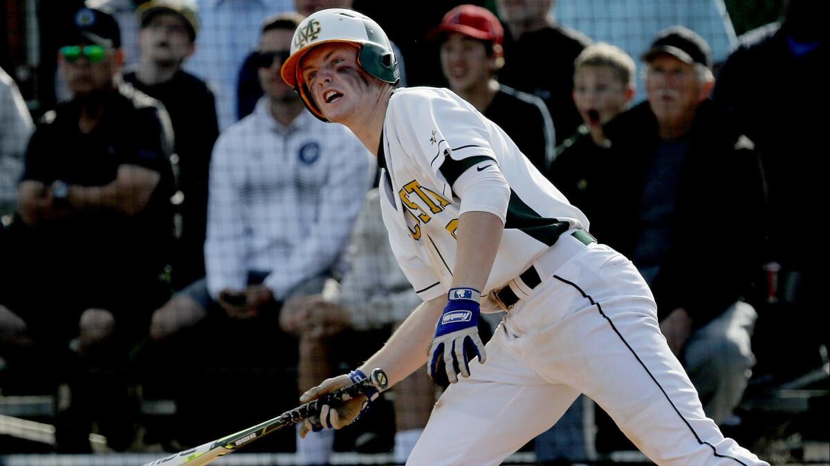 Mira Costa's Dylan Dennis drives in a pair of runs against JSerra during the sixth inning.