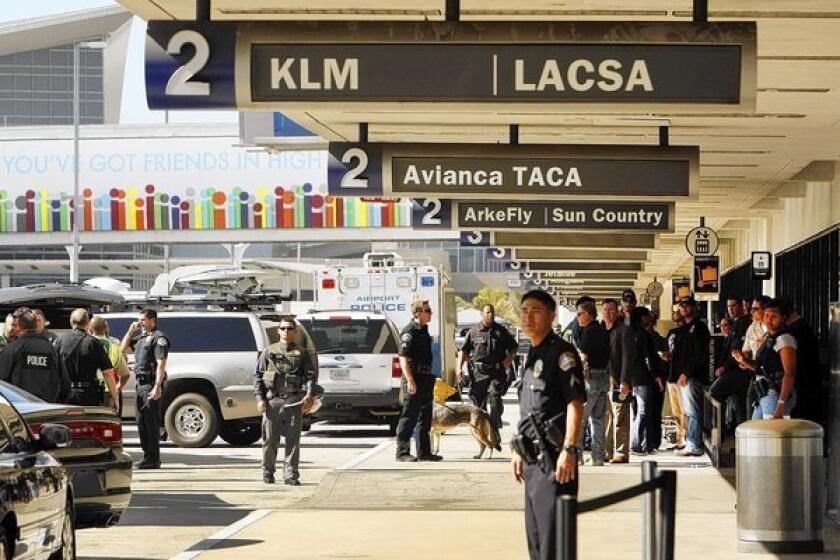 Police swarmed Los Angeles International Airport after a Transportation Security Administration agent was shot and three others wounded on Nov. 1, 2013.