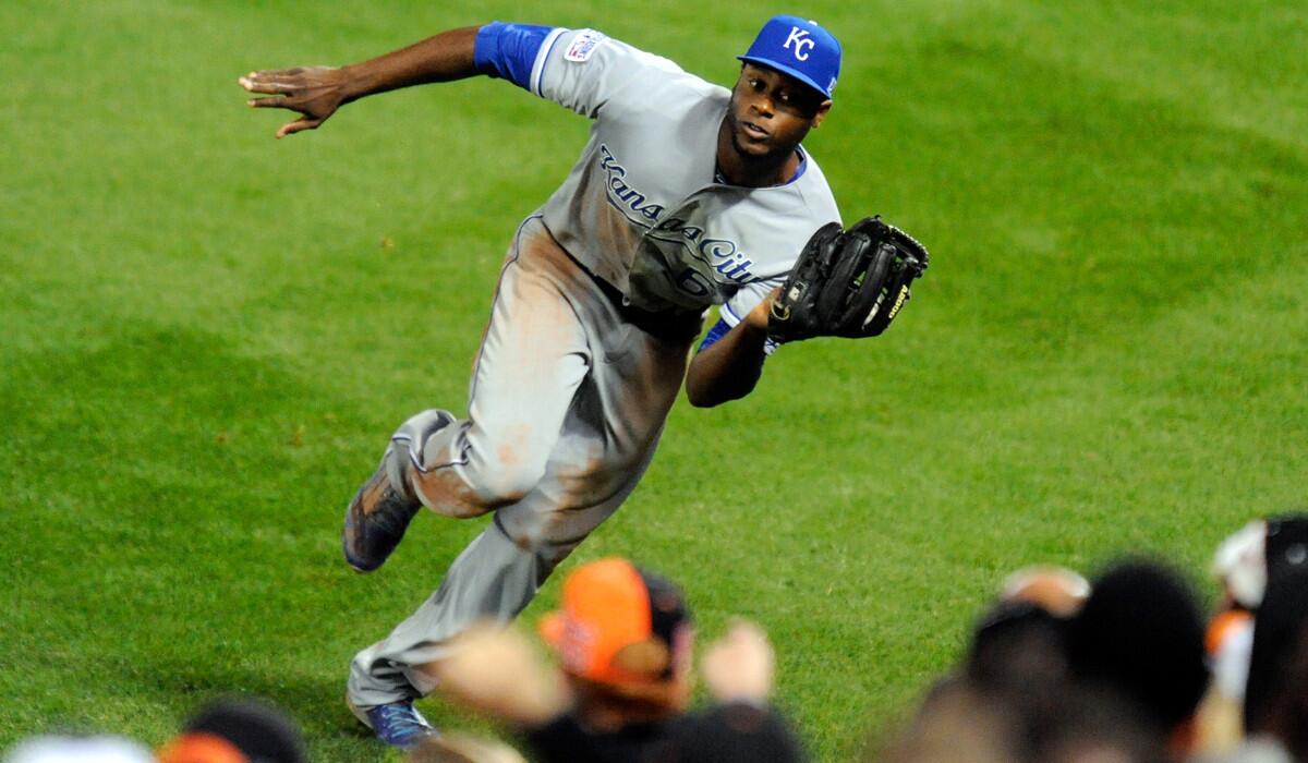Royals right fielder Lorenzo Cain makes a running catch near the foul line on a fly ball hit by Orioles shortstop J.J. Hardy to record the third out of the seventh inning in Game 2 of the ALCS on Saturday night in Baltimore.