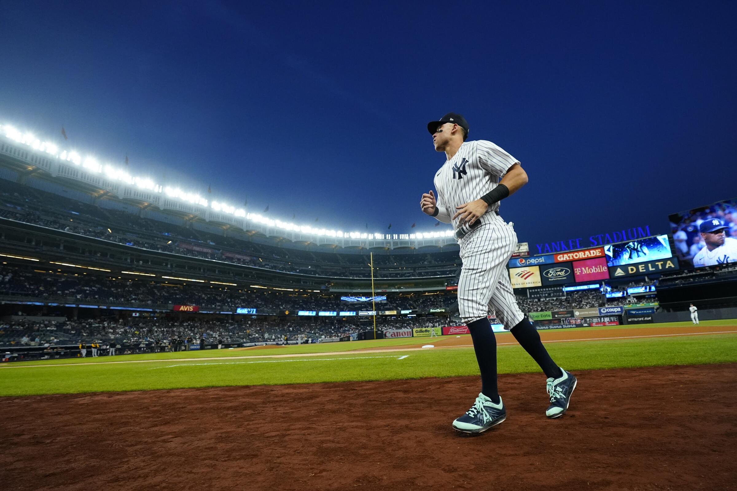 New York Yankees star Aaron Judge runs on the field before a game against the Pittsburgh Pirates in September. 